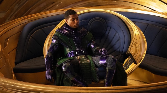Jonathan Majors sits in a velvet throne in "Ant-Man and the Wasp: Quantumania"