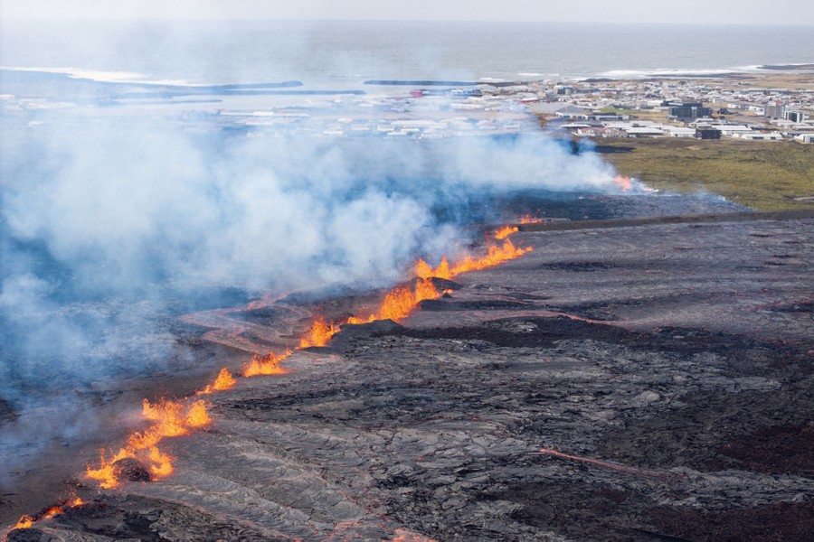Lava erupts from a fissure on the outskirts of an Icelandic fishing village.
