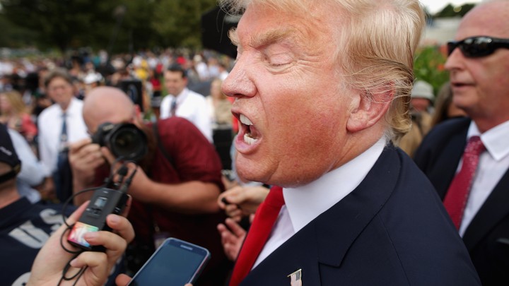 Donald Trump talks with journalists during a rally against the Iran nuclear deal