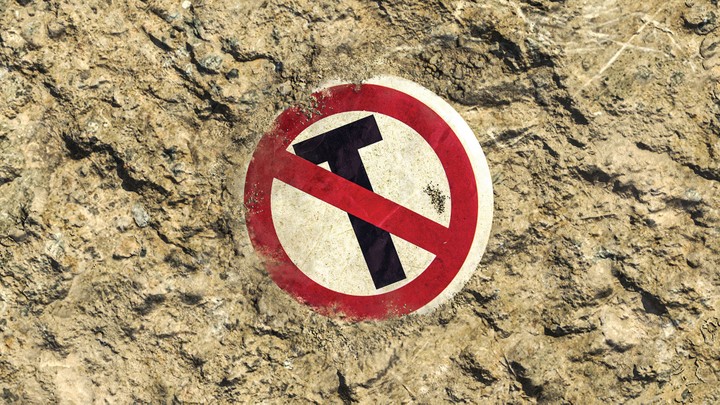 photo of a sign in the sand