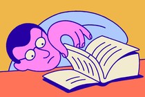 A person peeking at the end of a book