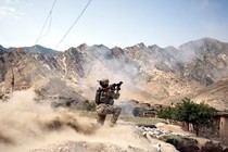 In Kunar Province's volatile Pech River Valley, a U.S. Army soldier fires a rocket-propelled grenade during a firefight with Taliban insurgents.