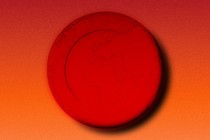 a red planet against an orange background