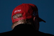 A photo of Donald Trump wearing a MAGA cap.