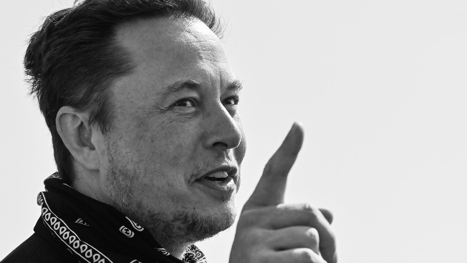 A black-and-white photo of Elon Musk with a bandana around his neck
