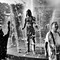 A black-and-white photo of people in a fountain, by Clay Benskin