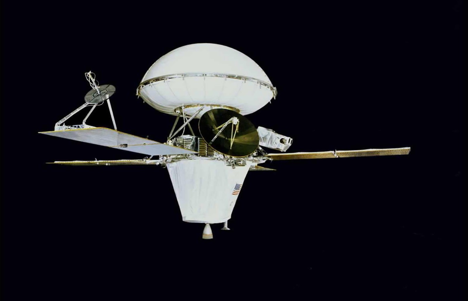 An image of the Viking 1 spacecraft in transit configuration—a rounded shell attached to the top of conical body with four small solar panels attached
