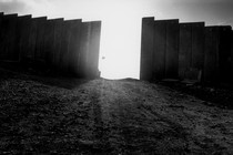 Picture of the wall surrounding a West Bank settlement