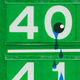 An illustration of a gas-station sign with tears falling from the price numbers