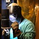 A welder is seen working. 