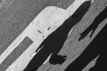 shadow of an adult hand reaching for a child's