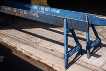 Two police barricades on the sidewalk