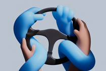 A black steering wheel with human hands surrounded and trapped by sinuous blue artificial arms and hands