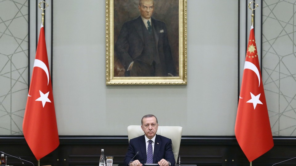 Turkish President Recep Tayyip Erdogan chairs a Cabinet meeting Monday, seated under a portrait of Mustafa Kemal Ataturk, the founder of modern Turkey.