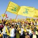 Supporters of Lebanon's Hezbollah leader Sayyed Hassan Nasrallah display Hezbollah and Lebanese flags.
