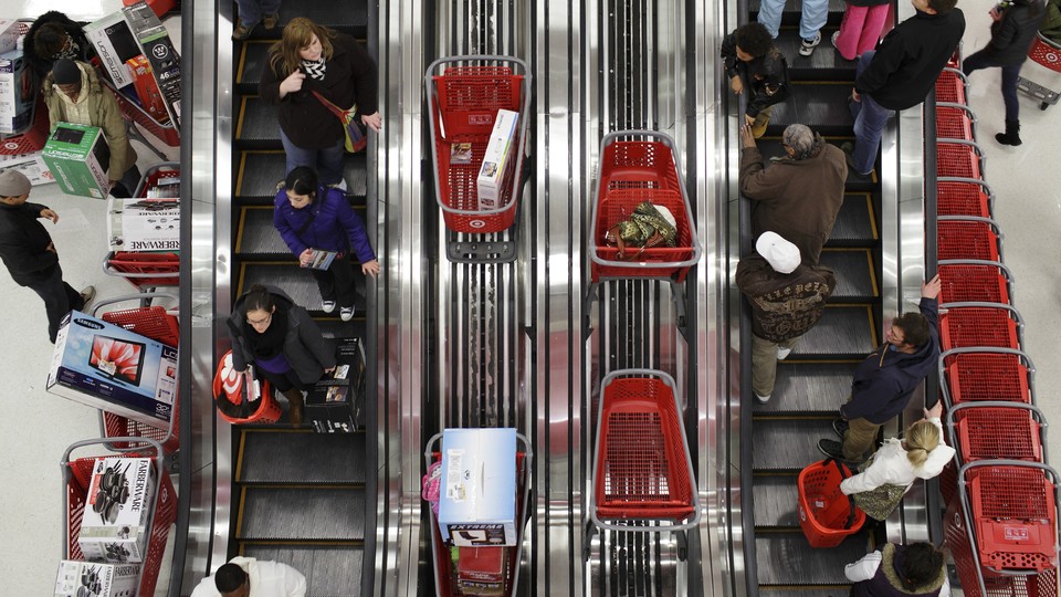 Shoppers ride an escalator in a Target store in Chicago