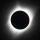 A photograph of the total solar eclipse in 2017, with the sun's corona glowing brightly against a dark sky