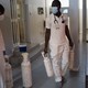 Two people who work for an emergency mobile service in Dakar, Senegal, carry oxygen tanks in a hallway