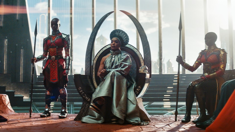 Angela Bassett as Queen Ramonda, sitting on a throne in "Black Panther: Wakanda Forever"