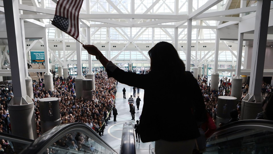 Thousands of people become naturalized citizens at this ceremony in Los Angeles in March.