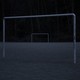 An abandoned soccer field in the dark