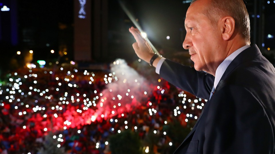 President Erdoğan waves to supporters far below