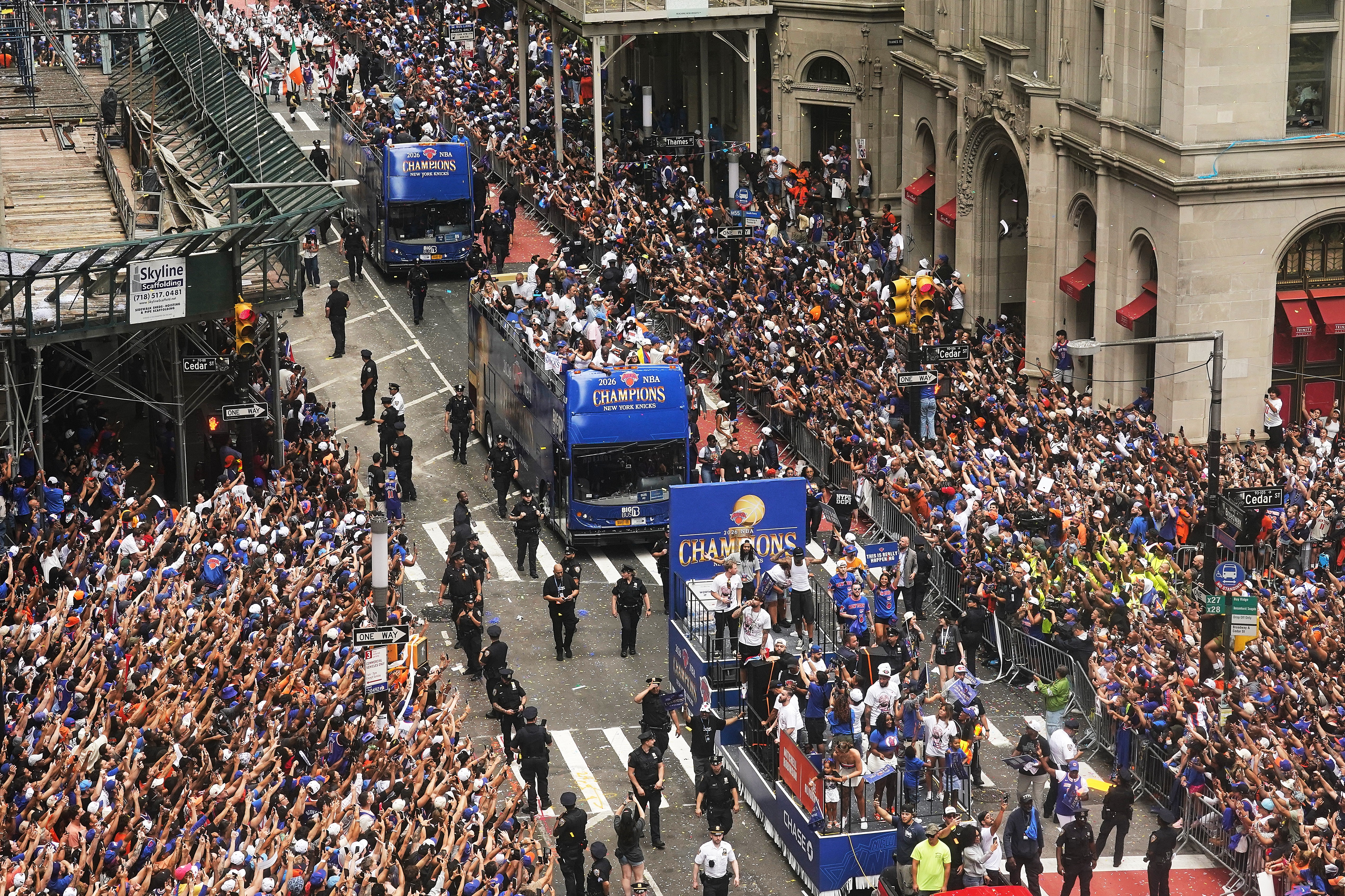 Crowds fill the sidewalks during the NBA Champion New York Knicks ticker-tape parade in New York City.