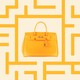 A yellow Hermès Birkin bag inside a yellow maze pattern