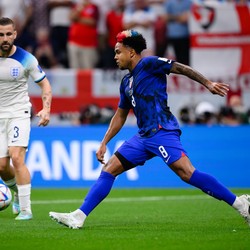 Weston McKennie of the U.S. controls the ball while England's Luke Shaw looks on