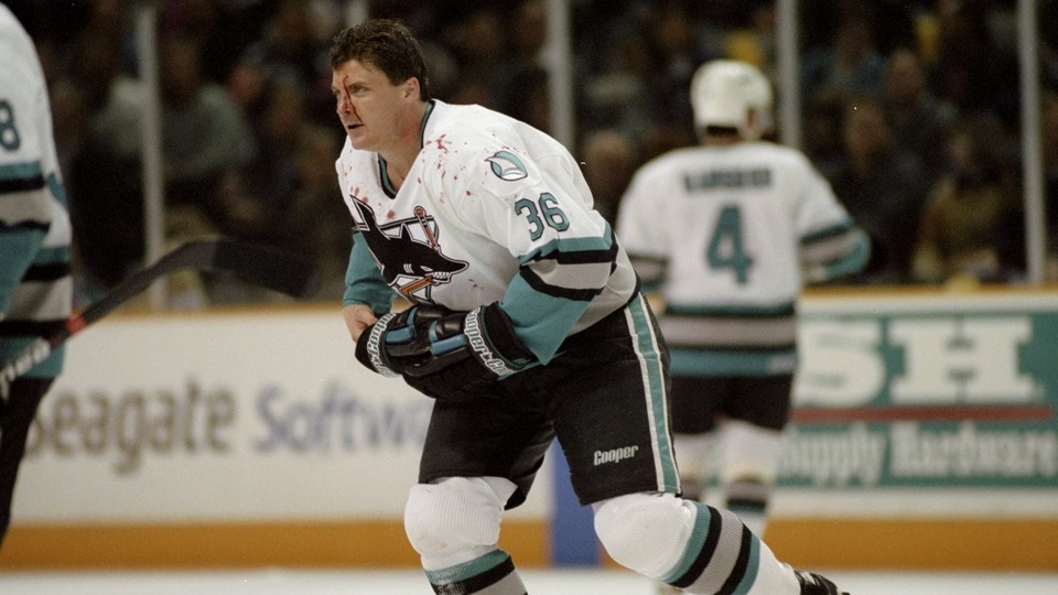 Todd Ewen skates with blood on his face, 1997