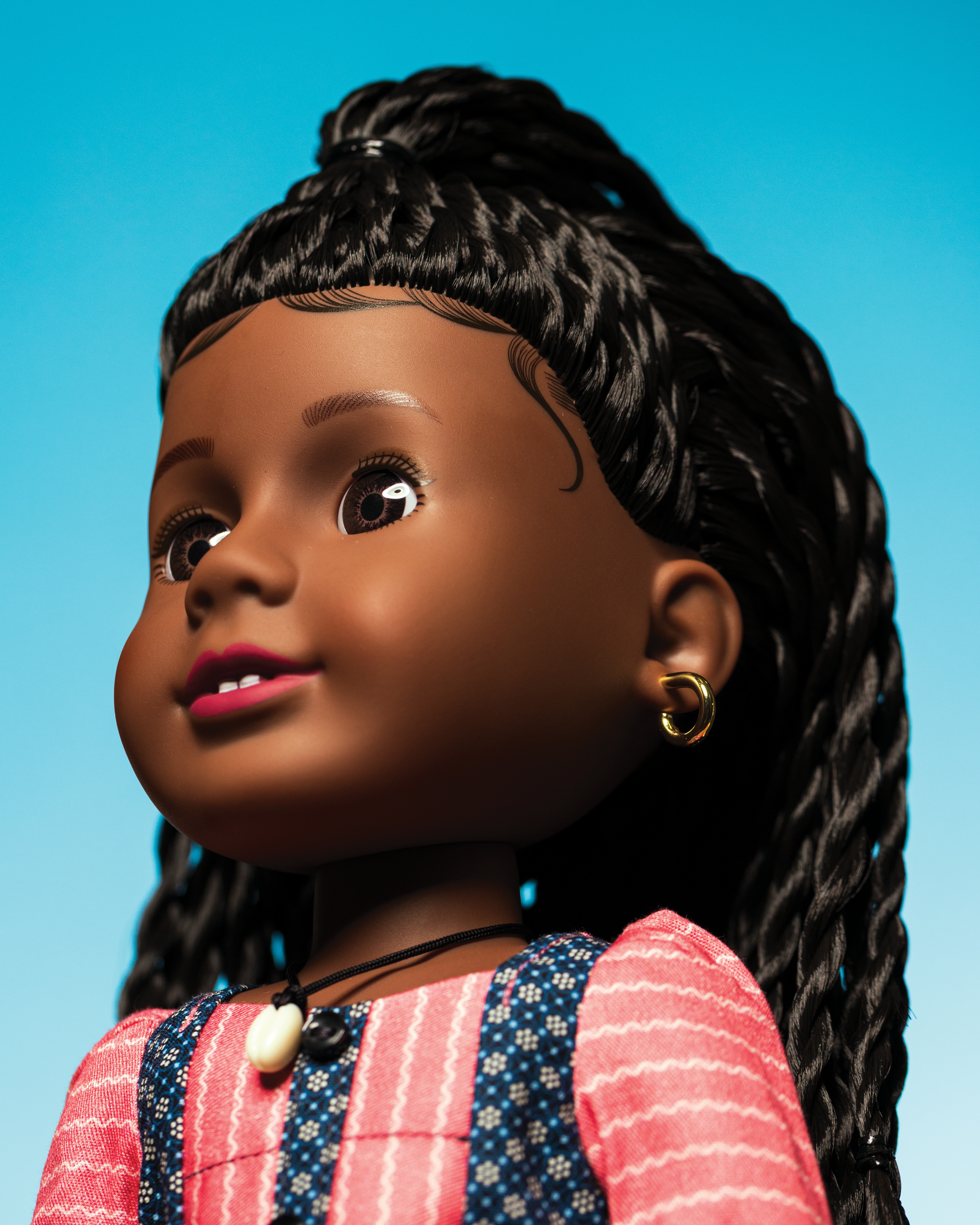 photo of Addy doll on blue background