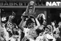 A photo of the University of South Carolina women's basketball team hoisting the NCAA championship trophy