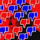 Red and blue thumbs-down emoji over a background image of Trump