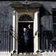 Boris Johnson walks through the door at Number 10 Downing Street.