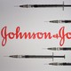 Vaccine needles surrounding the Johnson & Johnson logo