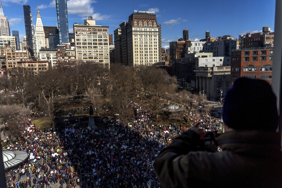 An elevated view of demonstrators gathering in a square in New York City