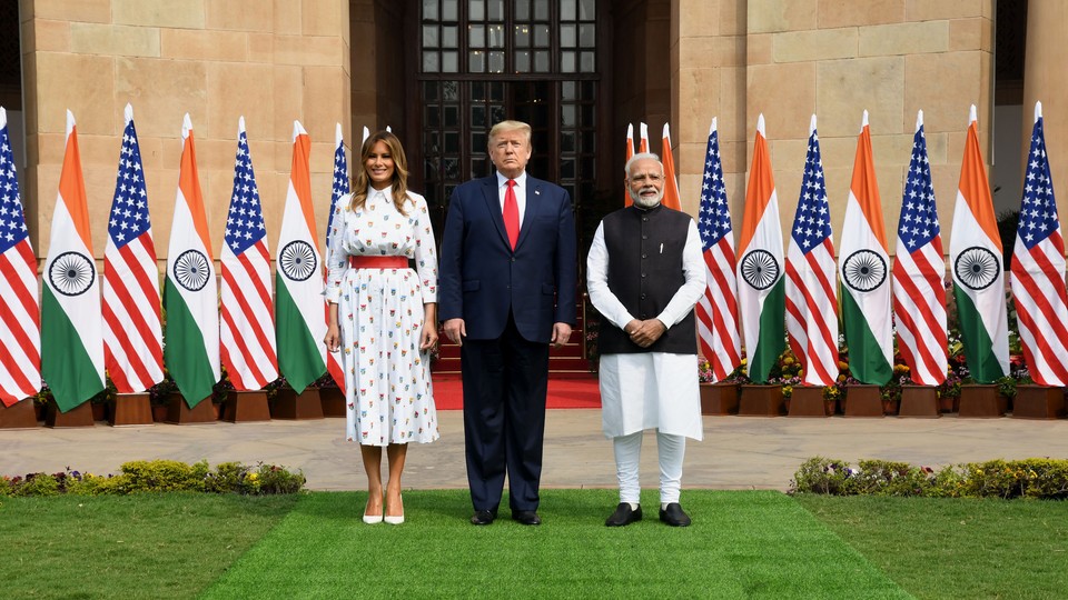 U.S. President Donald Trump and first lady Melania Trump pose with Indian Prime Minister Narendra Modi in New Delhi.