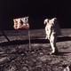 In a photo from 1969, Buzz Aldrin stands next to an American flag on the moon.
