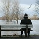 A man sitting alone on a bench