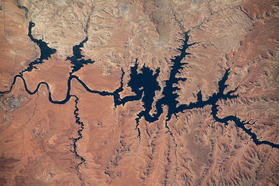 An aerial view of the twisting forks of a huge reservoir filling dry canyons