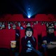 An audience watches a film in a theater in China