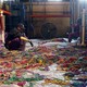 Sorting through Mardi Gras beads to recycle in New Orleans.