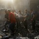 Picture of Palestinians carrying a casualty from the rubble in the aftermath of Israeli strikes in Khan Younis, in the southern Gaza Strip, on October 11, 2023.
