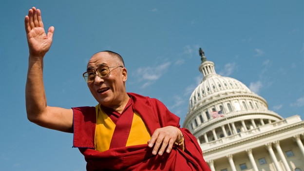 The Dalia Lama waves in front of the Capitol