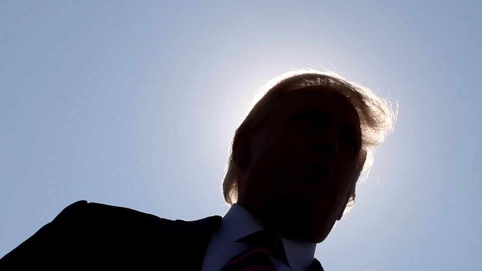 Donald Trump's face eclipsed by a halo of sunshine