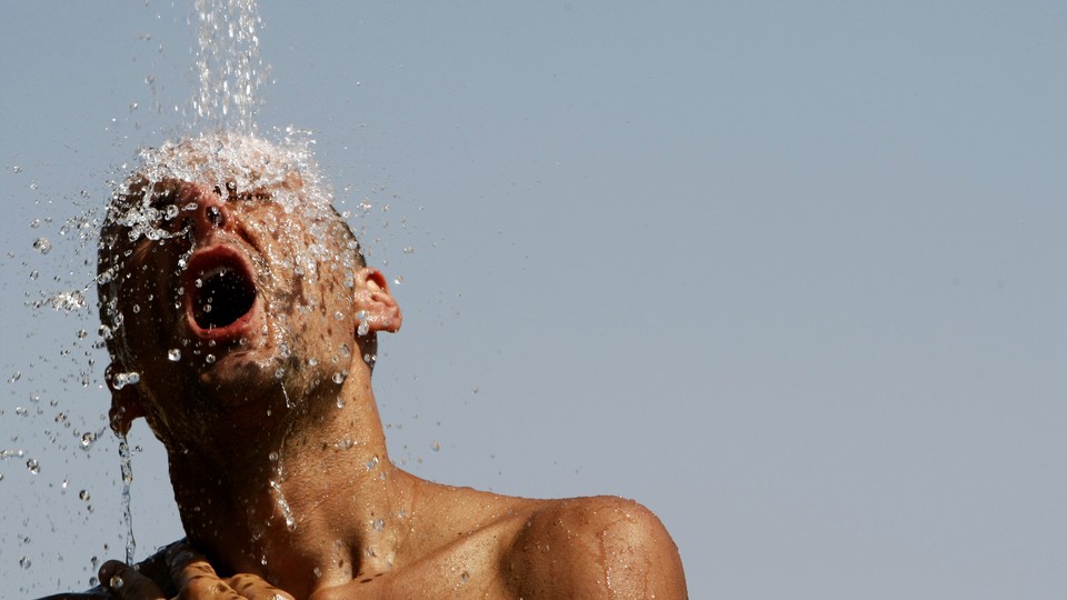 A man underneath a stream of water