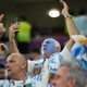 Argentina fans cheer as their team plays Australia in Doha on December 3, 2022