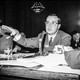 A photograph of Newton Minow at a hearing in 1961