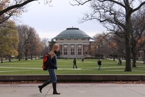 Students walk across the campus of the University of Illinois at Urbana-Champaign.