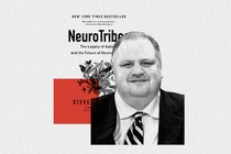 Steve Silberman in front of the cover of his book